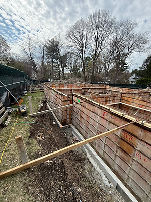 Detailed view of braced foundation wall forms at the Beverly Road new home project in Brookline
