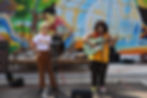 A group of people playing instruments on stage