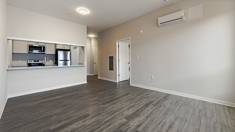 An apartment with wooden floor and furnished kitchen