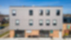 A grey apartment building