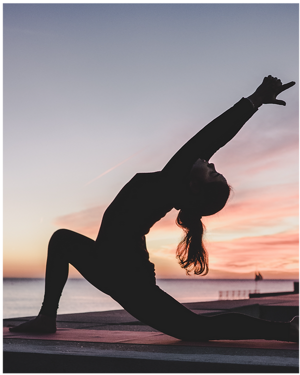silhouette photography of woman doing yoga_edited.png
