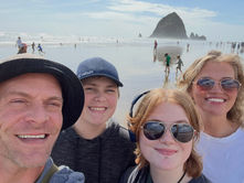 Family selfie on the Oregon coast during our trip before moving to Oregon