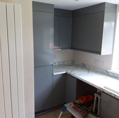 under renovation kitchen interior with dark cabinets