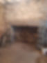 View of a stone fire chimney in the living room