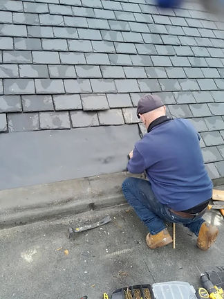 a worker repairing roof