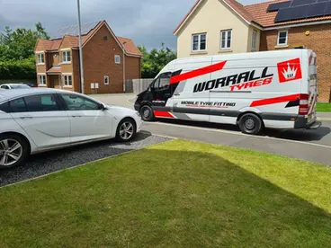 a van in front of white car