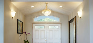 white door of a house and illuminated ceiling lights