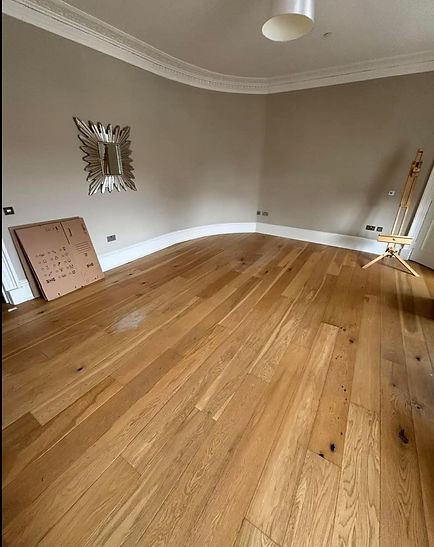 A clean room in a house, featuring a mirror