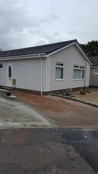 exterior of a building with white gutter system