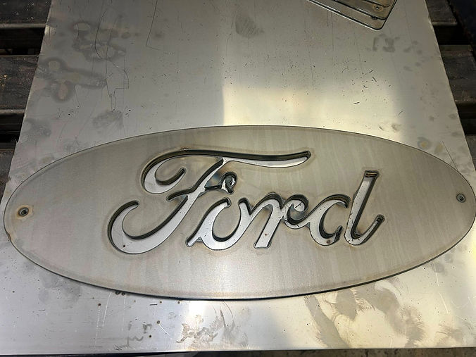 Ford logo displayed prominently on a metal sign