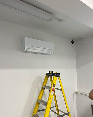 air conditioner and a ladder