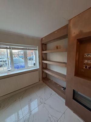 room under renovation with windows and radiator