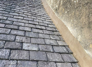 close-up image of dark roof tiles