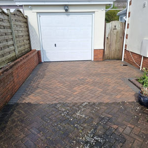 partially cleaned driveway of a house