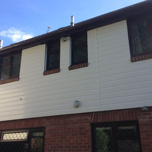 white exterior of a house with windows