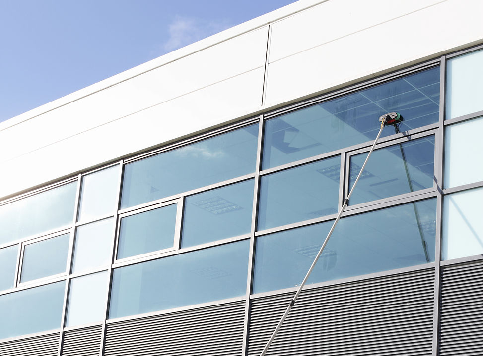close-up image of water fed pole system during window cleaning