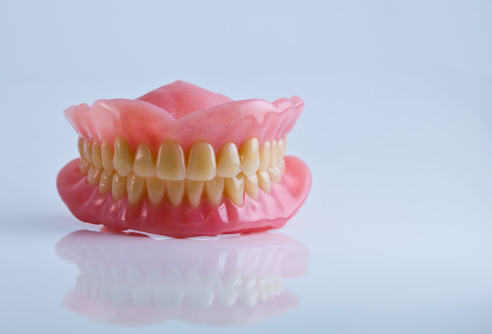 Full set of denture against an isolated white background