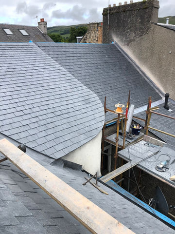 roof with black tiles and scaffolding 