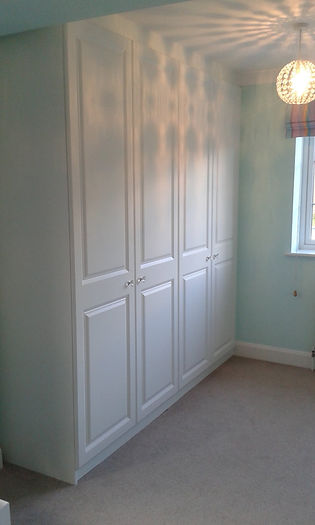 white wardrobe in a room