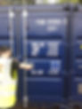 a worker closing blue storage container