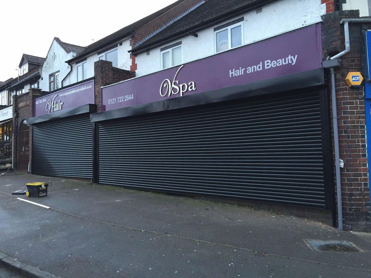 exterior view of a store with black shutter
