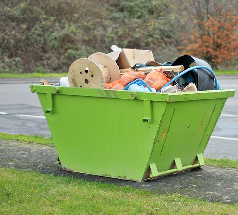 Green Skip Full Of Rubbish