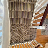 view from the top of carpeted stairs