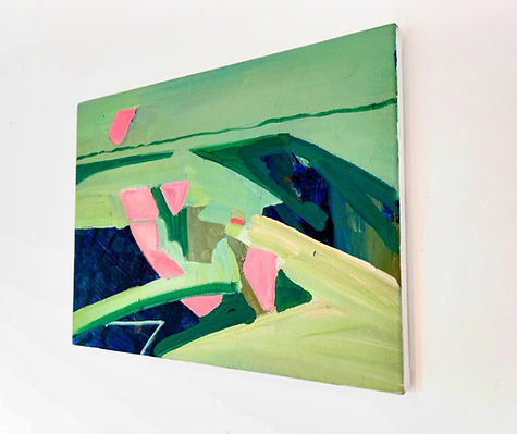 Abstract painting with green and pink shapes on canvas