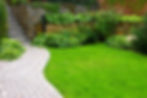 garden with pathway and green grass