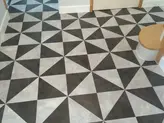 Geometric black-and-white tiled floor.