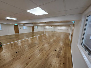 a large empty hall with white walls