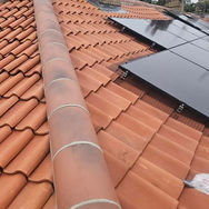 red tiles and solar panels on roof