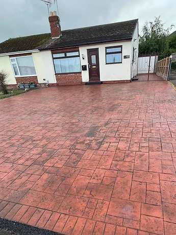 driveway with red-patterned paving stones