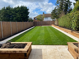 Manicured backyard with striped green lawn