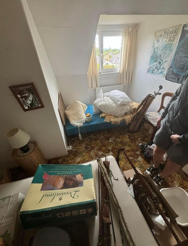 room interior with window, bed and white walls