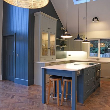 white and blue kitchen interior with illuminated ceiling lights
