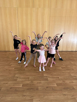 a group of happy children in dancing studio