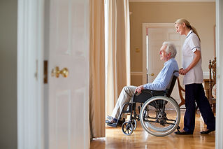 nurse pushing wheelchair
