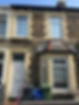 Front of a two-story, stone terraced house