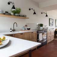 modern kitchen interior with wooden shelves and white countertop