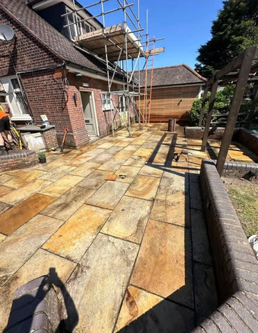 after image of a pressure washed patio area of a house
