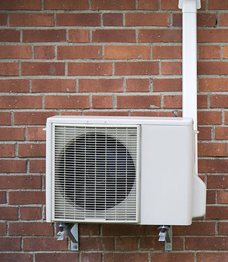 Air conditioning unit on brick wall