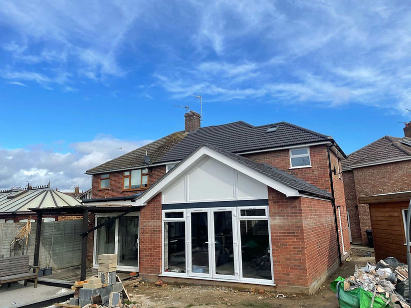 brick exterior of a house with blue sky in the background