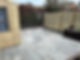 small backyard featuring a wooden fence and a cozy patio area