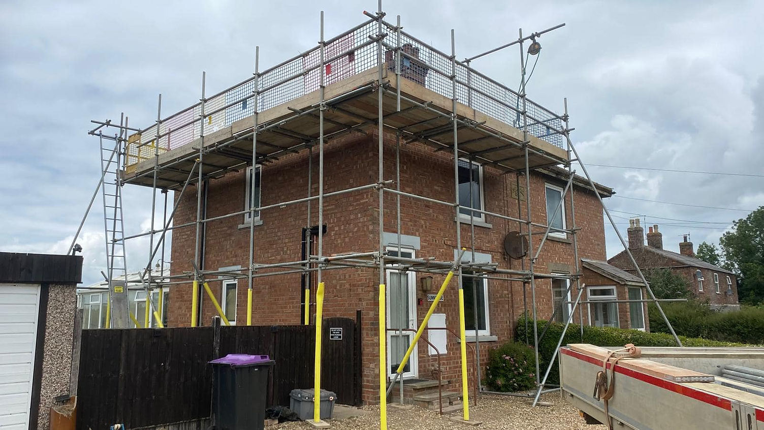 brick exterior of a house with scaffolding
