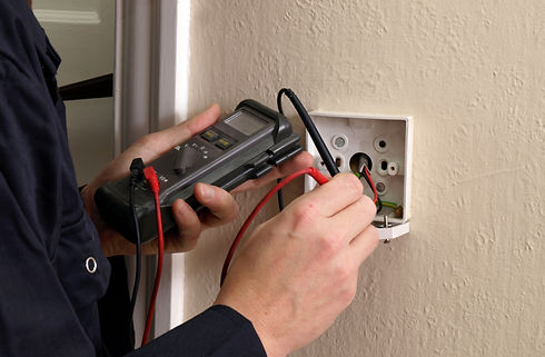 Electrician testing a switch