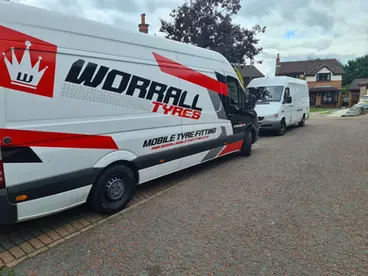 side view of a van with words "Worral Tyres"