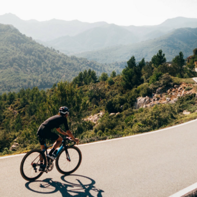 a man riding bike on mountains