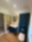 bathroom with blue cabinets