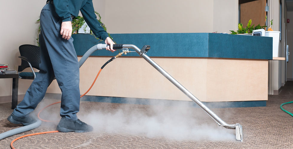 worker cleaning carpet in Office
